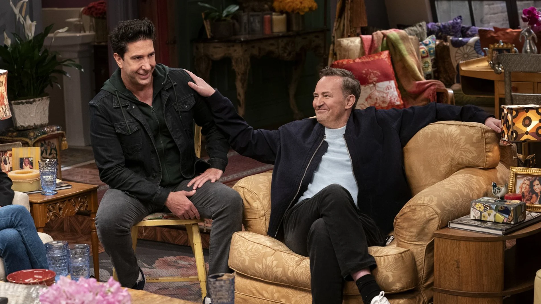 This image provided by HBO Max shows David Schwimmer, left, and Matthew Perry in a scene from the "Friends" reunion special. (Terence Patrick/HBO Max via AP)