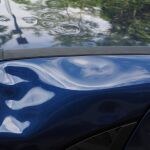 Imagen de un coche abollado
