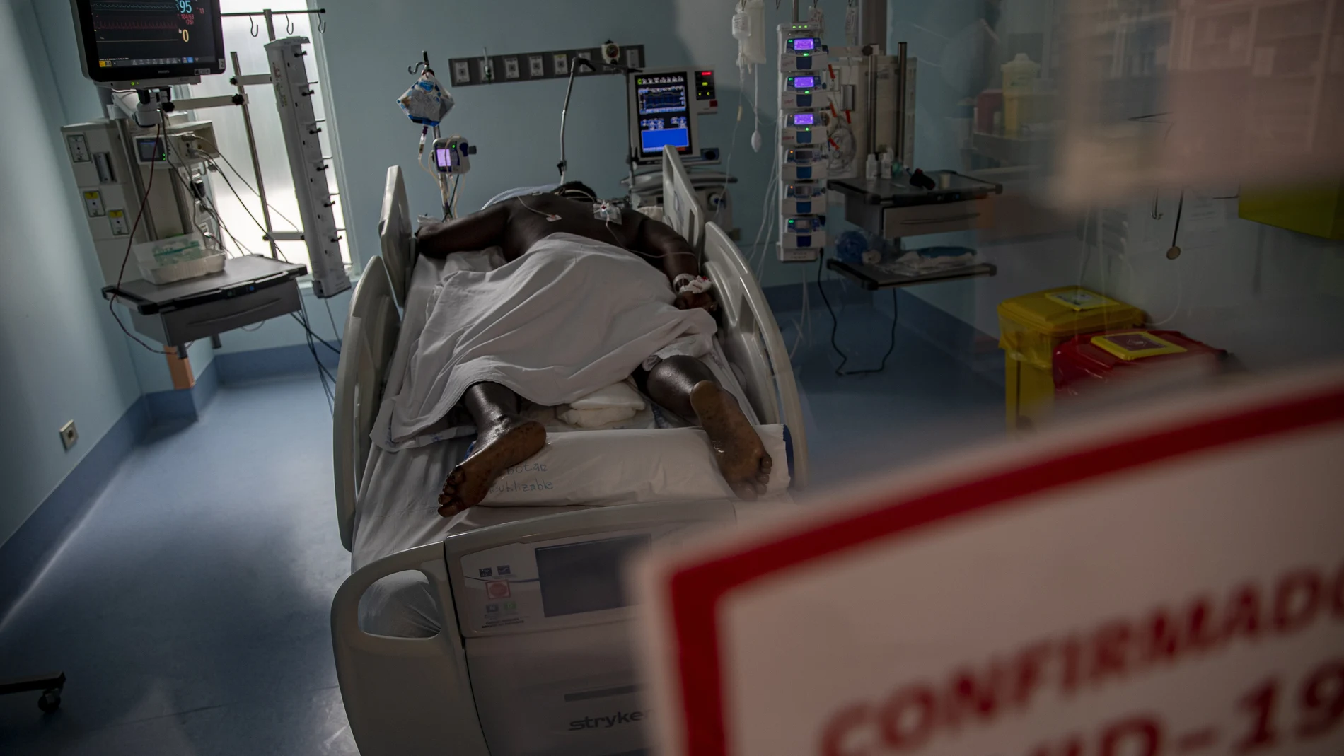 A COVID-19 patient lies in the ICU of the Posta Central Hospital in Santiago, Chile, Friday, June 4, 2021. Chile's Health Ministry reported on Friday that 97% of the nation's ICU hospital beds are full the majority with COVID-19. (AP Photo/Esteban Felix)