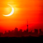 FILED - 10 June 2021, Canada, Toronto: A partial solar eclipse rises over the skyline of Toronto. Photo: Frank Gunn/The Canadian Press via ZUMA/dpaFrank Gunn/The Canadian Press vi / DPA10/06/2021 ONLY FOR USE IN SPAIN