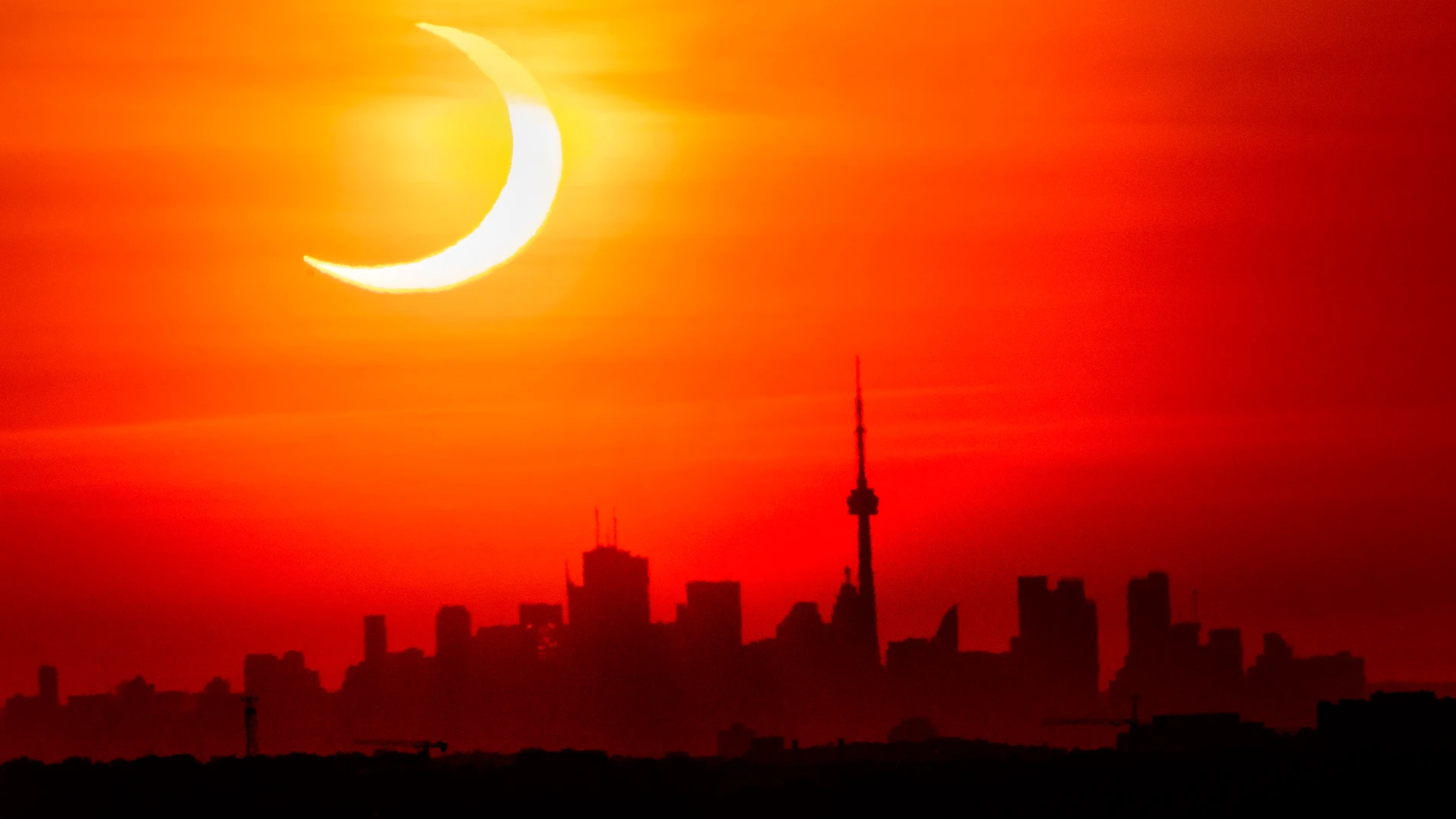 FILED - 10 June 2021, Canada, Toronto: A partial solar eclipse rises over the skyline of Toronto. Photo: Frank Gunn/The Canadian Press via ZUMA/dpaFrank Gunn/The Canadian Press vi / DPA10/06/2021 ONLY FOR USE IN SPAIN