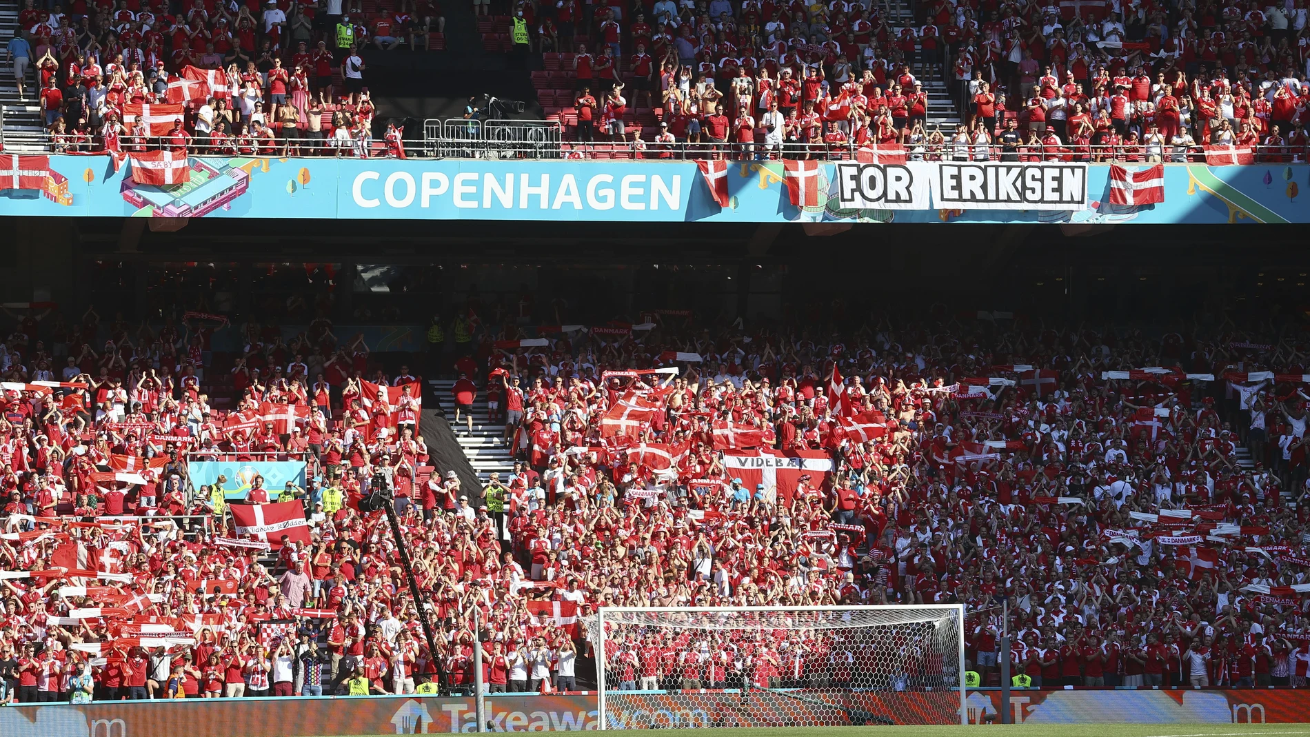 Denmark supporters display a banner for Christian Erikssen, the Danish player who collapsed during the match against Finland last Saturday, June 12, prior to the Euro 2020 soccer championship group B match between Denmark and Belgium, at the Parken stadium in Copenhagen, Thursday, June 17, 2021. (Wolfgang Rattay, Pool via AP)