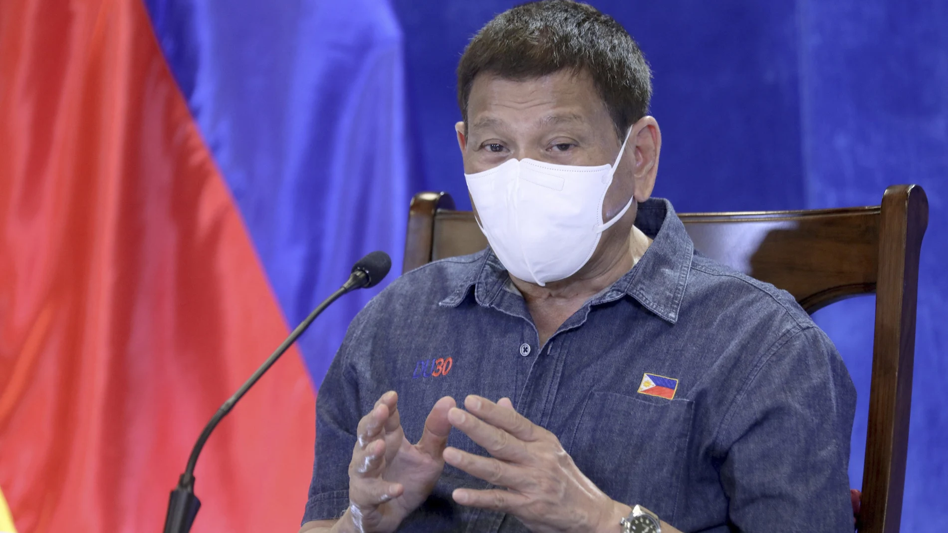 In this photo provided by the Malacanang Presidential Photographers Division, Philippine President Rodrigo Duterte gestures as he meets members of the Inter-Agency Task Force on the Emerging Infectious Diseases at the Malacanang presidential palace in Manila, Philippines, Monday, June 21, 2021. The Philippine president has threatened to order the arrest of Filipinos who refuse COVID-19 vaccination and told them to leave the country for hard-hit countries like India and the United States if they would not cooperate with massive efforts to end the pandemic. (Simeon Celi/Malacanang Presidential Photographers Division via AP)