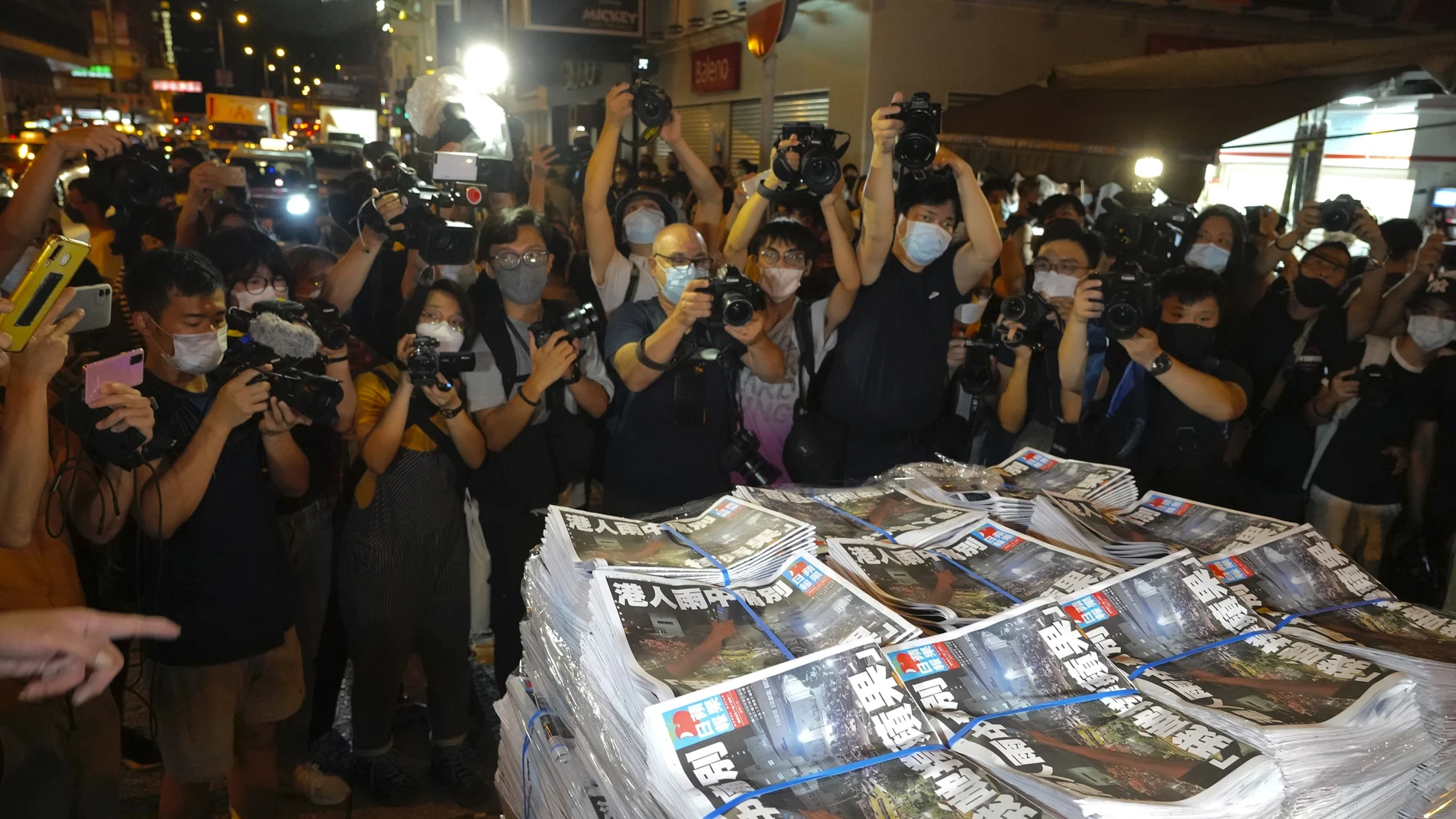 Last issue of Apple Daily arrive at a newspaper booth in Hong Kong, early Thursday, June 24, 2021. Hong Kong's pro-democracy Apple Daily newspaper will stop publishing Thursday, following last week's arrest of five editors and executives and the freezing of $2.3 million in assets under the city's year-old national security law. (AP Photo/Vincent Yu)