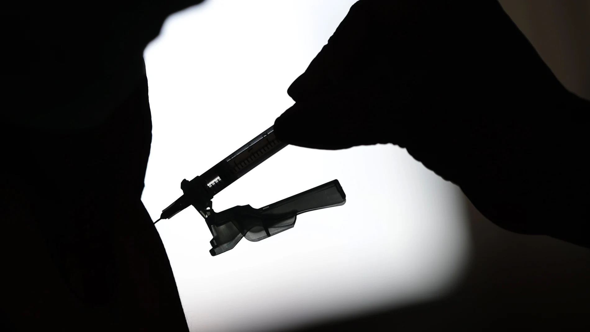 A health worker gives a shot of the Johnson & Johnson COVID-19 vaccine inside the Solidary Hands Shelter for the homeless in the poor neighborhood of Ceilandia in Brasilia, Brazil, Tuesday, June 29, 2021. (AP Photo/Eraldo Peres)