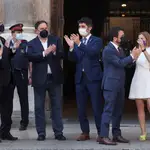 FILE PHOTO: Catalonia&#39;s regional President Pere Aragones and Vice President Jordi Puignero clap with Catalonia&#39;s pardoned separatist leaders Jordi Turull, Joaquim Forn, Oriol Junqueras, Carme Forcadell and Raul Romeva, ahead of a reception at Palau de la Generalitat in Barcelona, Spain June 28, 2021. REUTERS/Albert Gea/File Photo