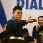 CORRECTS THAT LESTHER ALEMAN IS NOT A PRESIDENTIAL HOPEFUL BUT AN OPPOSITION FIGURE - FILE - In this May 16, 2018 file photo, student representative Lesther Aleman interrupts Nicaraguan President Daniel Ortega, shouting that he must halt repression during the opening of the national dialogue on the outskirts of Managua, Nicaragua. Among the opposition figures in Nicaragua who have not been arrested is Aleman, the then-student leader who famously in 2018 urged Ortega to resign during talks aimed at resolving the country's social crisis. Aleman remains in Nicaragua, but keeps his location secret for safety reasons. (AP Photo/Alfredo Zuniga, File)