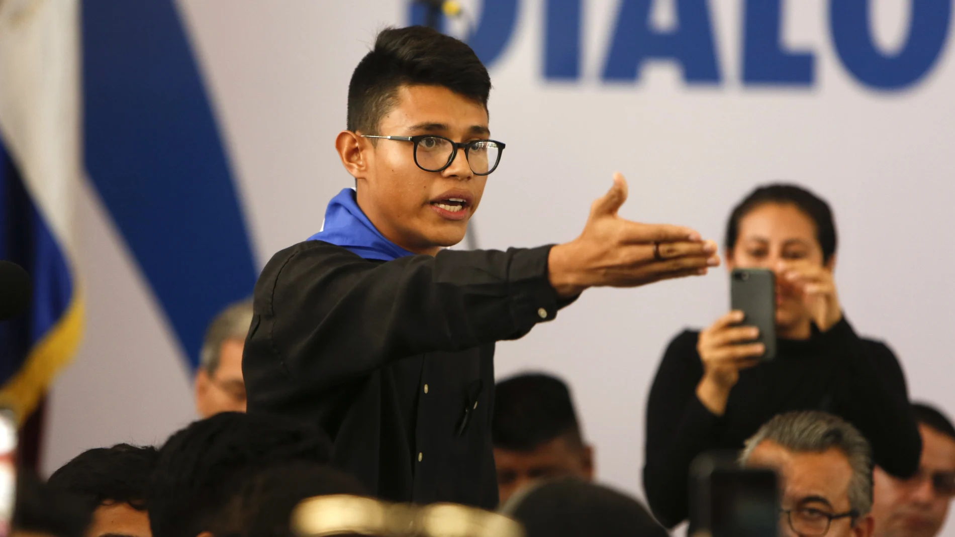 CORRECTS THAT LESTHER ALEMAN IS NOT A PRESIDENTIAL HOPEFUL BUT AN OPPOSITION FIGURE - FILE - In this May 16, 2018 file photo, student representative Lesther Aleman interrupts Nicaraguan President Daniel Ortega, shouting that he must halt repression during the opening of the national dialogue on the outskirts of Managua, Nicaragua. Among the opposition figures in Nicaragua who have not been arrested is Aleman, the then-student leader who famously in 2018 urged Ortega to resign during talks aimed at resolving the country's social crisis. Aleman remains in Nicaragua, but keeps his location secret for safety reasons. (AP Photo/Alfredo Zuniga, File)