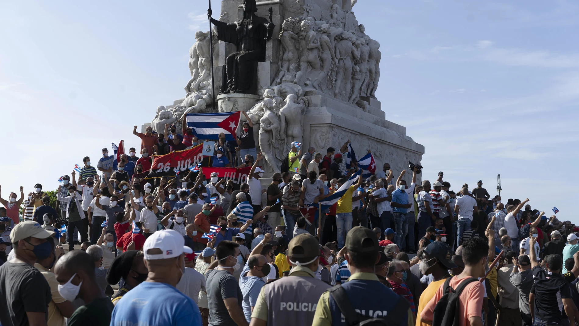 CORRECTS TO GOVERNMENT SUPPORTERS - Government supporters gather at the Maximo Gomez monument in Havana, Cuba, Sunday, July 11, 2021. Supporters of the government took to the streets at the time hundreds more protested against ongoing food shortages and high prices of foodstuffs.. (AP Photo/Eliana Aponte)