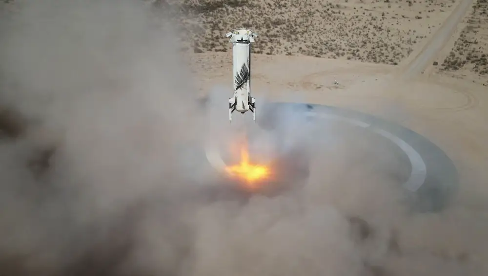 In this Jan. 14, 2021 photo made available by Blue Origin, the New Shepard NS-14 booster rocket lands at Launch Site One in West Texas. (Blue Origin via AP)
