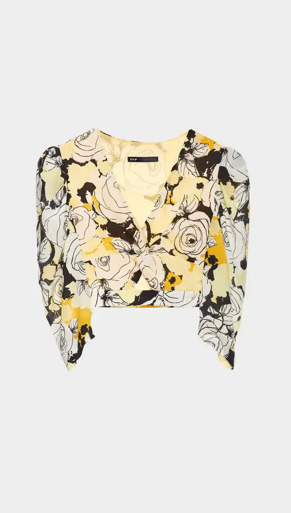 Blusa crop, confeccionada en tejido de seda floral print en tonos amarillos y negros