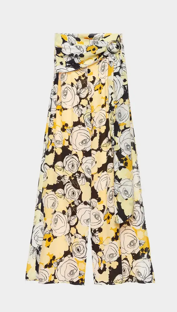 Pantalón de corte flare, confeccionado en tejido de seda floral print en tonos amarillos y negros