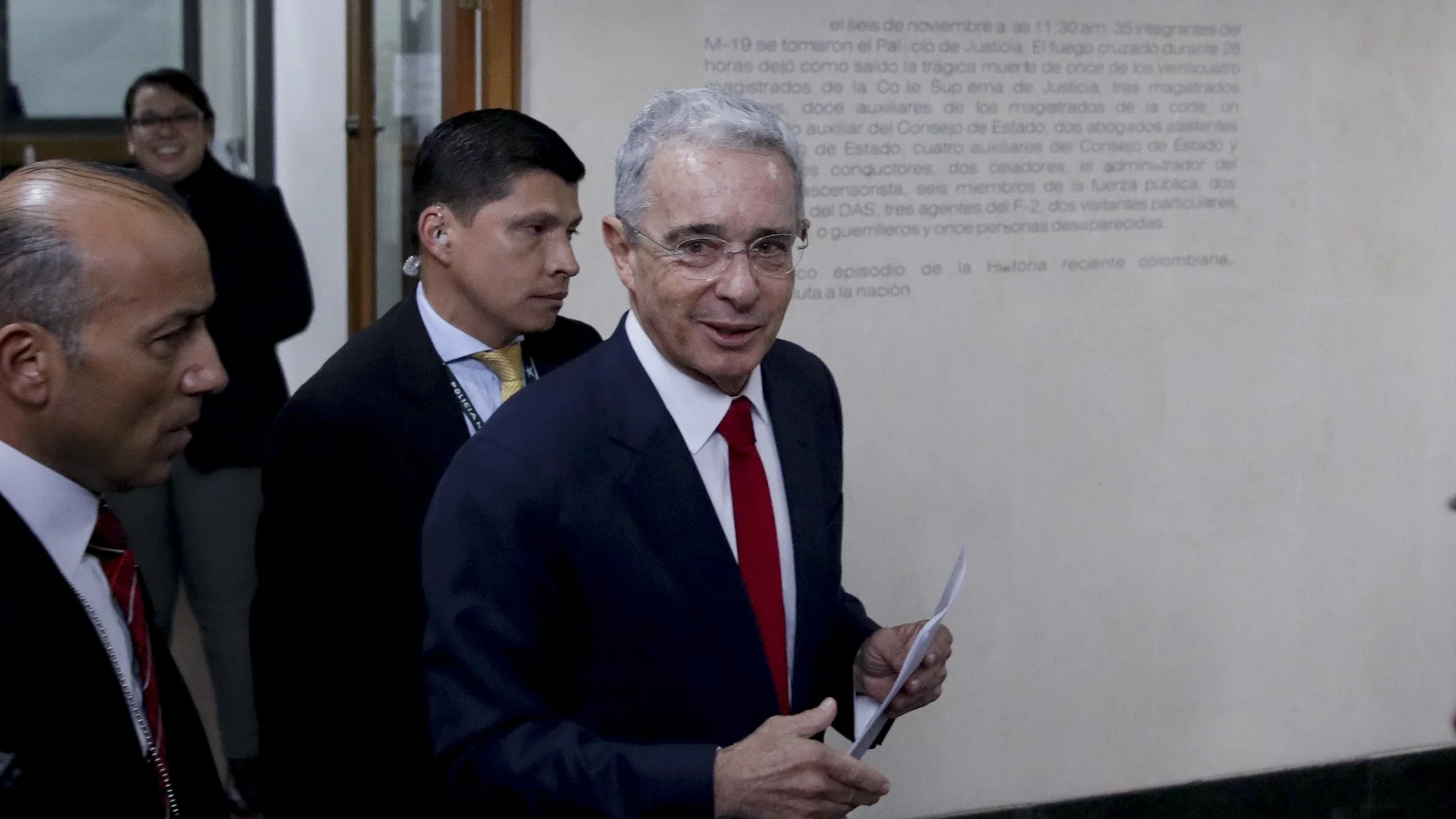 FILE - In this Oct. 8, 2019 file photo, Senator and former president Alvaro Uribe arrives to the Supreme Court for questioning in an investigation for witness tampering charges in Bogota, Colombia. Former president Uribe gave his version on Monday, Aug. 16, 2021, on his part regarding the countryÂ´s armed conflict to the Truth Commission. (AP Photo/Ivan Valencia, File)