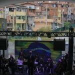 Musicians residents in the Paraisopolis favela, as part of the community's centennial celebration, in Sao Paulo, Brazil, Thursday, Sept. 16, 2021. One of the largest favela's in Brazil, home to tens of thousands of residents in the country's largest and wealthiest city, Paraisopolis is grappling with crime and a pandemic that have challenged daily life for many who live there, but organizers say its people have built a vibrant community and are launching a 10-day celebration of its achievements. (AP Photo/Andre Penner)