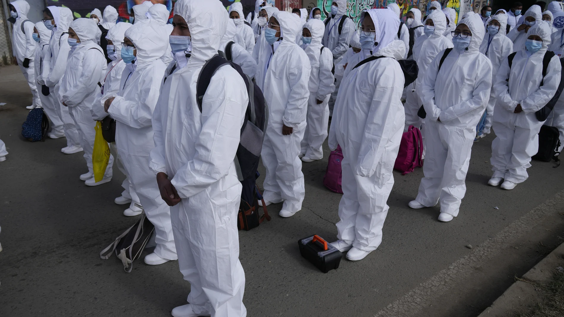 Healthcare workers take part in a ceremony kicking off a door-to-door COVID-19 vaccination campaign, in El Alto, Bolivia, Thursday, Sept. 16, 2021. (AP Photo/Juan Karita)