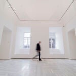 Una persona pasa por una de las nuevas salas del edificio Sabatini, en el Museo Reina Sofía