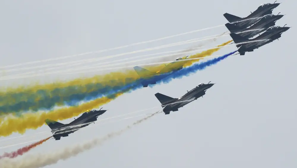 Members of the &quot;August 1st&quot; Aerobatic Team of the Chinese People's Liberation Army (PLA) Air Force perform during the 13th China International Aviation and Aerospace Exhibition on Wednesday, Sept. 29, 2021, in Zhuhai in southern China's Guangdong province. (AP Photo/Ng Han Guan)