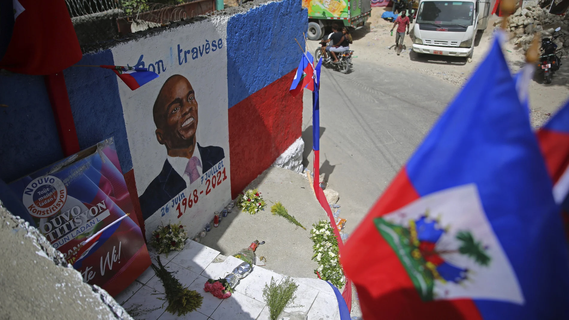 FILE - In this July 21, 2021 file photo, a mural depicting the late President Jovenel Moise adorns a wall in the Kenscoff neighborhood of Port-au-Prince, Haiti. A police superintendent in Jamaica told The Associated Press on Thursday, Oct. 21, 2021, that authorities have arrested a Colombian man they believe is a suspect in the July 7 assassination of Moise. (AP Photo/Joseph Odelyn)