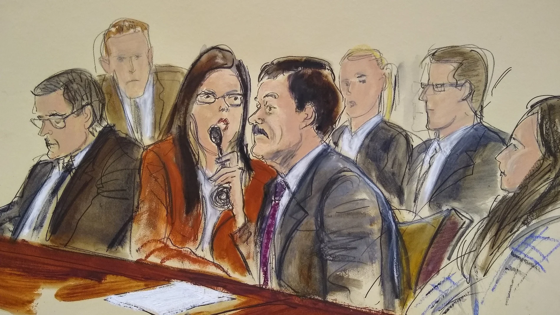 FILE - In this July 17, 2019 file photo of a courtroom sketch, Joaquin "El Chapo" Guzman, second from right, listens to his sentence via interpreter while surrounded by U.S. Marshals and flanked by his defense attorney Marc Fernich, during his sentencing in federal court in New York. Lawyers for the Mexican drug kingpin, who was convicted in February 2019 on multiple conspiracy counts in an epic drug-trafficking case and was sentenced to life behind bars in a U.S. prison, are appealing on Oct. 25, 2021 in hopes of overturning his life sentence. (Elizabeth Williams via AP, File)