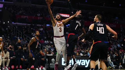 Oct 27, 2021; Los Angeles, California, USA; Cleveland Cavaliers guard Ricky Rubio (3) is defended by LA Clippers guard Reggie Jackson (1) in the second half at Staples Center. Mandatory Credit: Kirby Lee-USA TODAY Sports