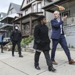 FILE - In this Saturday, Oct. 23, 2021, file photo, Buffalo mayoral candidate India Walton, front left, and New York Sen. Sean Ryan take part in a walking tour of local businesses in Buffalo, N.Y. The race for mayor of Buffalo has four-term incumbent Byron Brown relying on a write-in campaign to fend off a challenge from newcomer Walton, who identifies herself as a democratic socialist. (AP Photo/Joshua Bessex, File)