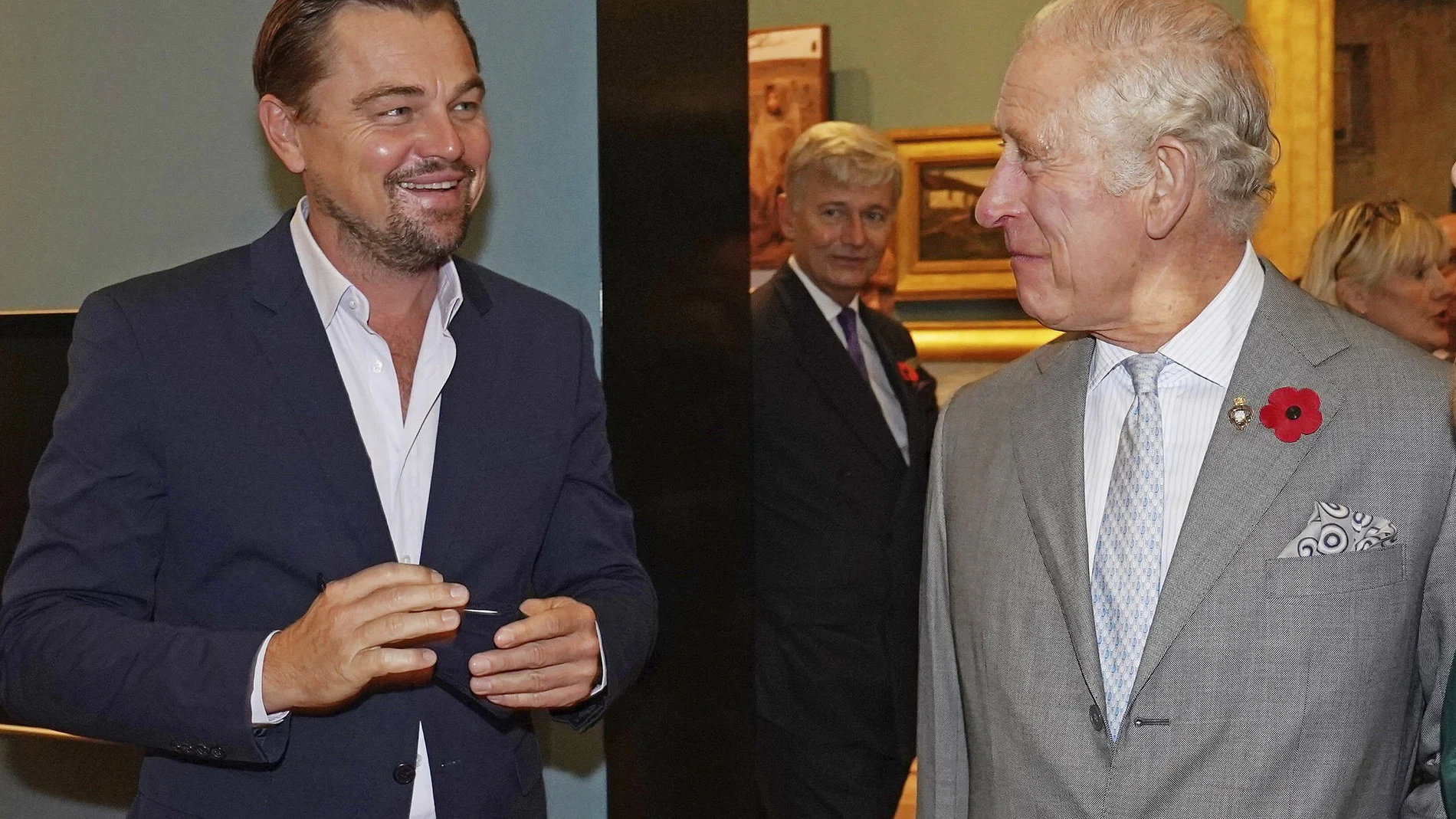 Britain's Prince Charles, right, speaks with Leonardo DiCaprio, left, as he views a fashion installation at the Kelvingrove Art Gallery and Museum, during the Cop26 summit being held at the Scottish Event Campus (SEC) in Glasgow, Scotland, Wednesday, Nov. 3, 2021. (Owen Humphreys/Pool via AP)