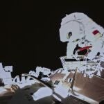 In this image released by the Xinhua News Agency, a photo taken on a screen shows Chinese astronaut Wang Yaping conducts an activities outside the space station's Tianhe core module, at Beijing Aerospace Control Center on Sunday, Nov. 7, 2021. Wang Yaping has become the first Chinese woman to conduct a spacewalk as part of a six-month mission to the country's space station. Wang and fellow astronaut Zhai Zhigang left the station's Tianhe core module on Sunday evening Beijing time, spending more than six hours installing equipment and carrying out tests alongside the station's robotic service arm. (Guo Zhongzheng/Xinhua via AP)
