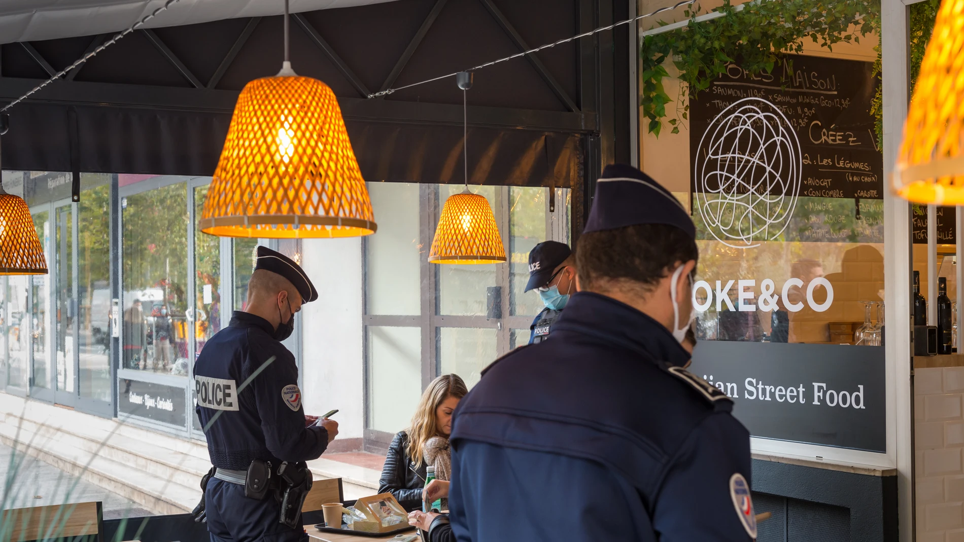 November 24, 2021, Draguignan, Var, France: Police officers are seen checking the health pass of a customer in a restaurant..Due to a surge in Covid-19 positive cases, the French government has decided to reinforce the controls on the obligation of the Sanitary Pass in restaurants and bars. The main objective for the French government is to slow down a fifth wave of contamination before the Christmas period and to avoid confinement measures.24/11/2021