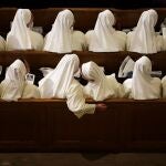 Nuns sit in their pews while waiting for Pope Francis to arrive inside the Basilica of the National Shrine of the Immaculate Conception.