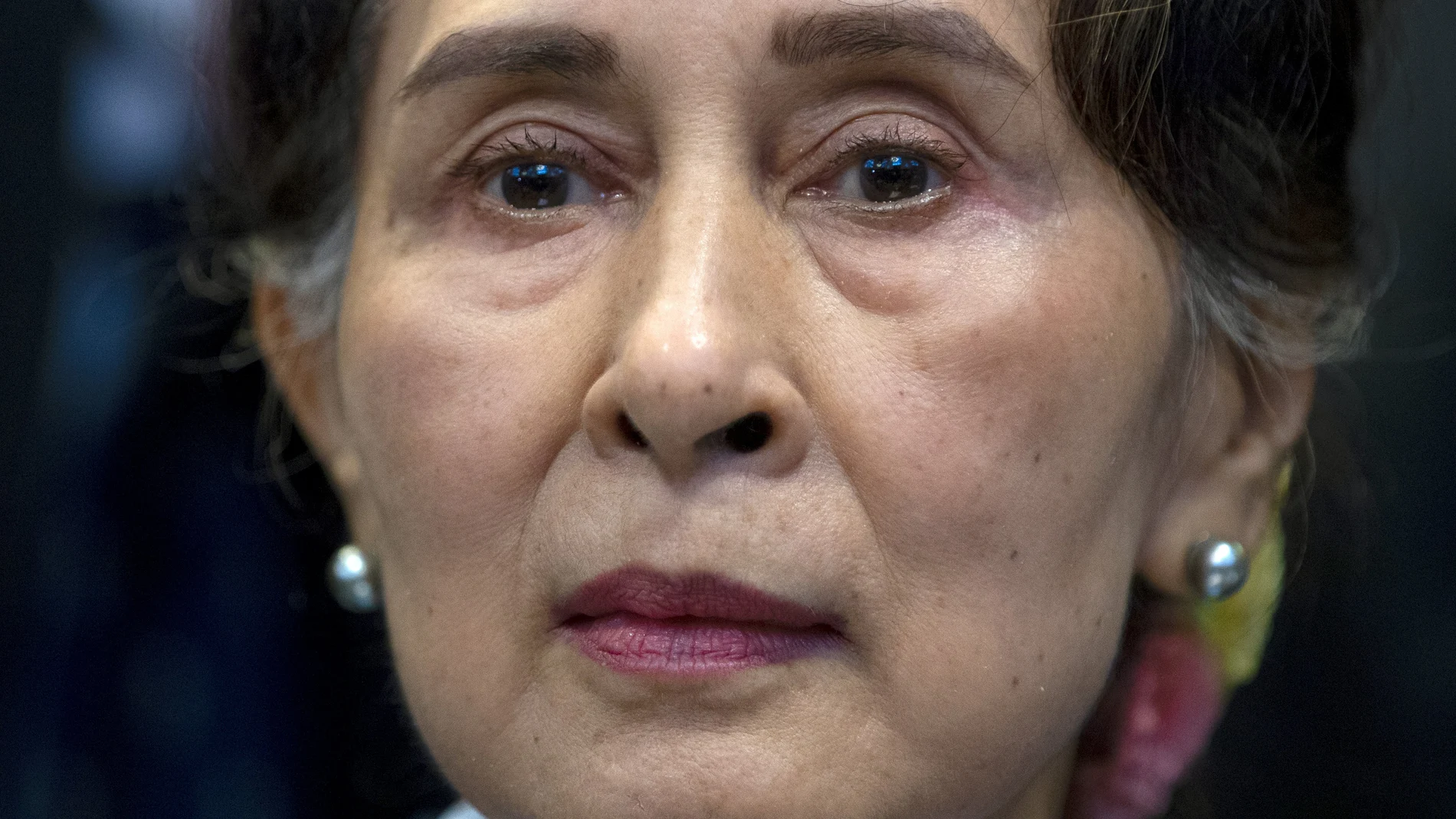 FILE - Myanmar's leader Aung San Suu Kyi waits to address judges of the International Court of Justice on the second day of three days of hearings in The Hague, Netherlands on Dec. 11, 2019. (AP Photo/Peter Dejong, File)