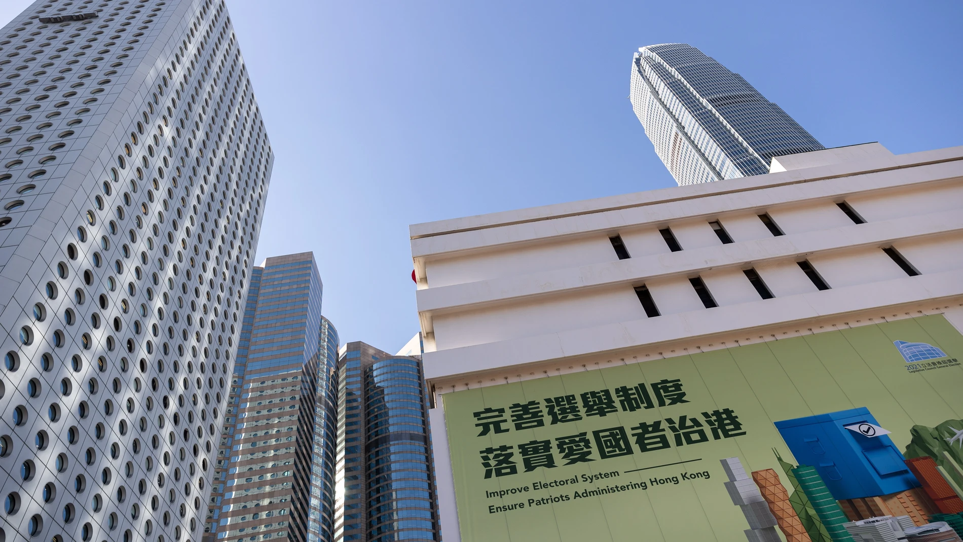 Hong Kong (China), 02/12/2021.- An advertising poster for the legislative elections is displayed on the side of the General Post Office in Hong Kong, China, 02 December 2021. The 2021 Hong Kong legislative general election will take place on 19 December 2021, over a year after being postponed and following a drastic Beijing-imposed electoral system overhaul. (Elecciones) EFE/EPA/JEROME FAVRE