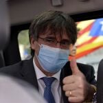 Exiled Catalan separatist leader Carles Puigdemont leaves the appeals court at the end of the hearing, in Sassari, Sardinia