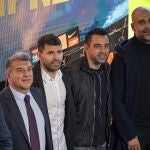 Barcelona striker Sergio Aguero poses for a photo with Barcelona president Joan Laporta, left, Manchester City's head coach Pep Guardiola, right, and Barcelona's head coach Xavi, center, during a press conference at the Camp Nou stadium in Barcelona, Spain, Wednesday, Dec. 15, 2021. Sergio Aguero has announced his retirement from football on Wednesday due to a heart condition. (AP Photo/Emilio Morenatti)