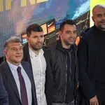 Barcelona striker Sergio Aguero poses for a photo with Barcelona president Joan Laporta, left, Manchester City&#39;s head coach Pep Guardiola, right, and Barcelona&#39;s head coach Xavi, center, during a press conference at the Camp Nou stadium in Barcelona, Spain, Wednesday, Dec. 15, 2021. Sergio Aguero has announced his retirement from football on Wednesday due to a heart condition. (AP Photo/Emilio Morenatti)