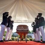 FILE PHOTO: Presidential honor guards salute next to the coffin of late Haitian President Jovenel Moise, who was shot dead earlier this month, during the funeral at his family home in Cap-Haitien, Haiti, July 23, 2021. REUTERS/Ricardo Arduengo/File Photo