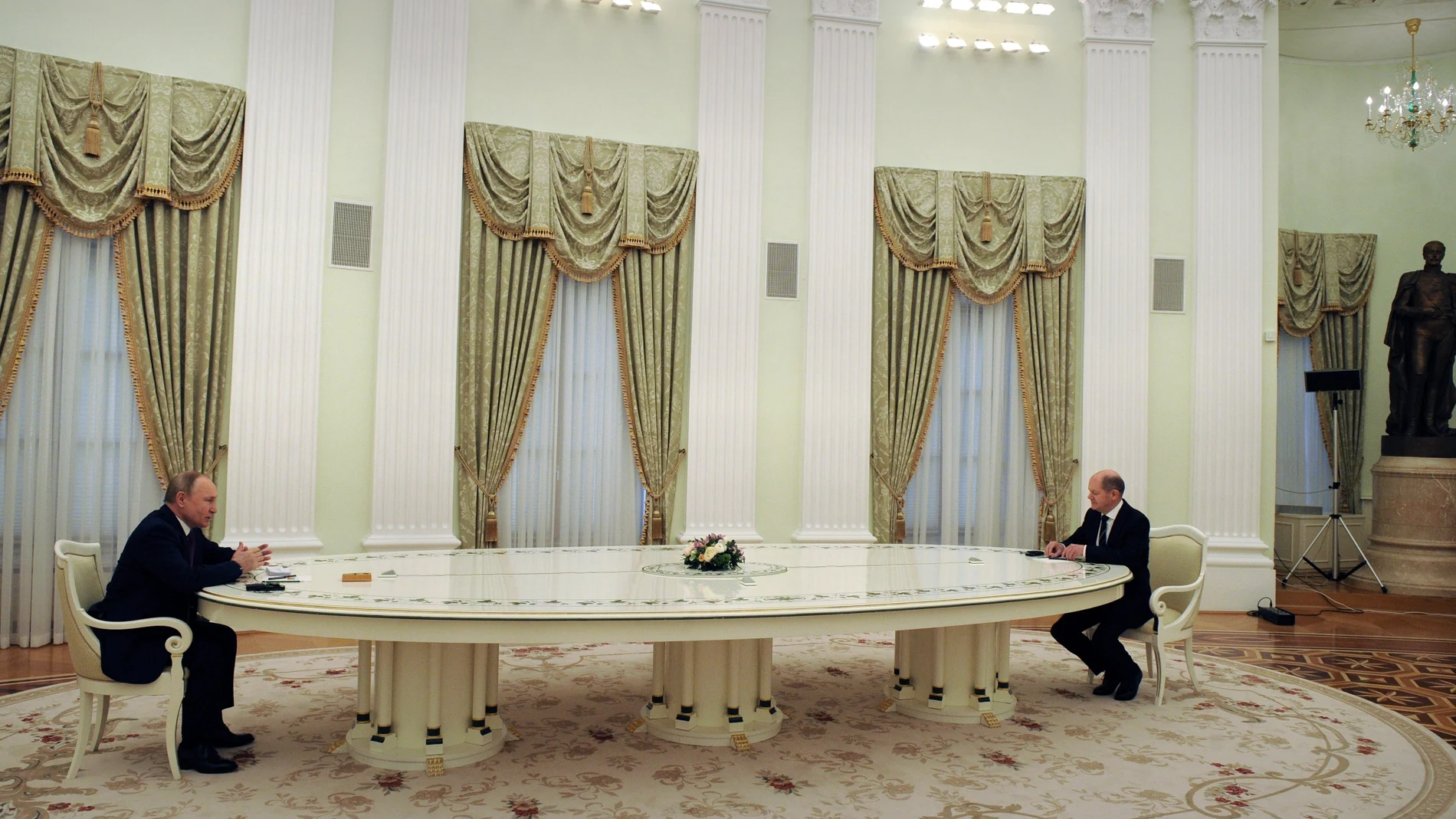 Russian President Vladimir Putin, left, and German Chancellor Olaf Scholz during their talks in the Kremlin in Moscow, Russia, Tuesday, Feb. 15, 2022. (Mikhail Klimentyev, Sputnik, Kremlin Pool Photo via AP)