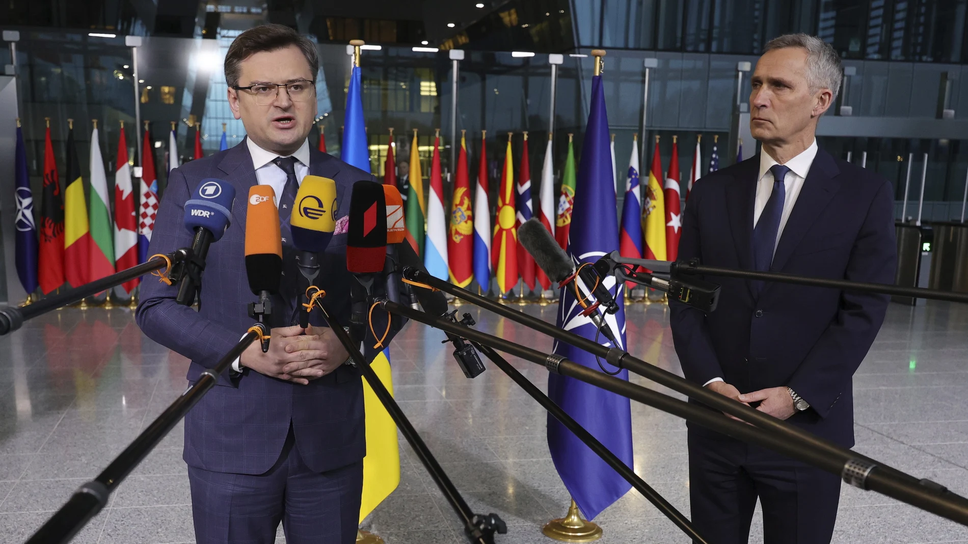 Ukraine's Foreign Minister Dmytro Kuleba, left, and NATO Secretary General Jens Stoltenberg speak with the media as they arrive for a meeting of NATO foreign ministers at NATO headquarters in Brussels, Thursday, April 7, 2022. NATO foreign ministers are meeting to discuss how to bolster their support to Ukraine, including by supplying weapons to the conflict-torn country, without being drawn into a wider war with Russia. (AP Photo/Olivier Matthys)