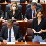 El consejero de Presidencia, Justicia e Interior, Enrique López y la presidenta de la Comunidad de Madrid, Isabel Díaz Ayuso