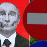 Una mujer pasa junto a un póster que representa al presidente ruso Vladimir Putin en Bucarest.