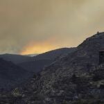 A partially charred building damaged during a wildfire near Bejis, eastern Spain, on Wednesday, Aug. 17, 2022. The European Forest Fire Information System says 275,000 hectares (679,000 acres) have burned in wildfires so far this year in Spain. That's more than four times the country's annual average of 67,000 hectares (165,000 acres) since 2006, when records began. (AP Photo/Alberto Saiz)