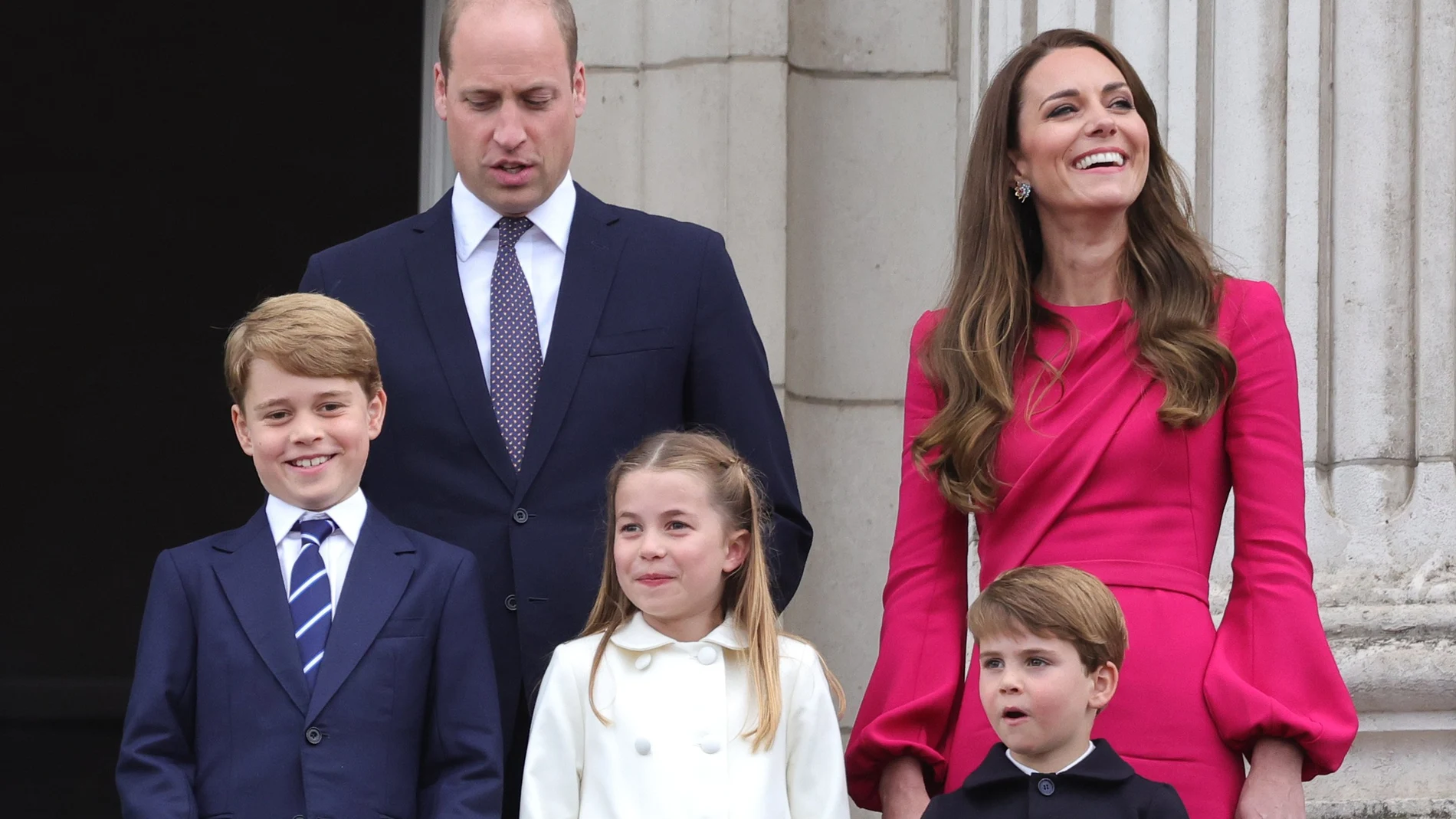 FILE - Britain's Prince William, Kate, Duchess of Cambridge, Prince George, Princess Charlotte and Prince Louis, appear on the balcony of Buckingham Palace, during the Platinum Jubilee Pageant outside Buckingham Palace in London, June 5, 2022. Prince William and his wife, Kate, will relocate their family from central London to more rural dwellings in Windsor, and all three of their children will attend the same private school near their new home, palace officials said Monday Aug. 22, 2022. (Chris Jackson/PA via AP, File)