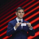 Hungarian former player Zoltan Gera shows the name of Real Betis during the soccer Europa League draw in Istanbul, Turkey, Friday, Aug. 26, 2022. (AP Photo/Emrah Gurel)