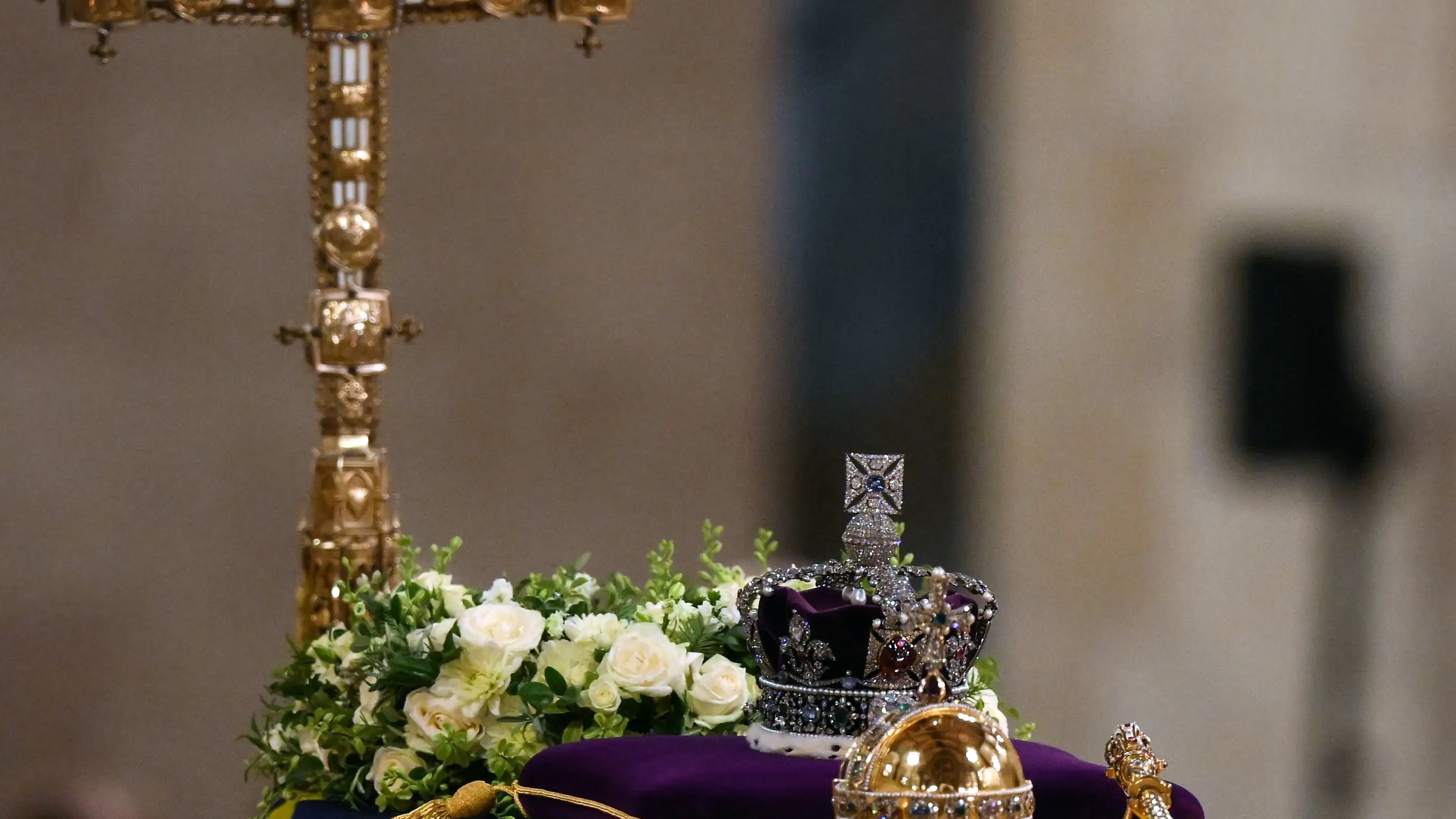 The coffin of Queen Elizabeth II, draped in the Royal Standard with the Imperial State Crown and the Sovereign's orb and sceptre, lying in state on the catafalque in Westminster Hall, at the Palace of Westminster in London, Friday Sept. 16, 2022. (Daniel Leal/Pool Photo via AP)