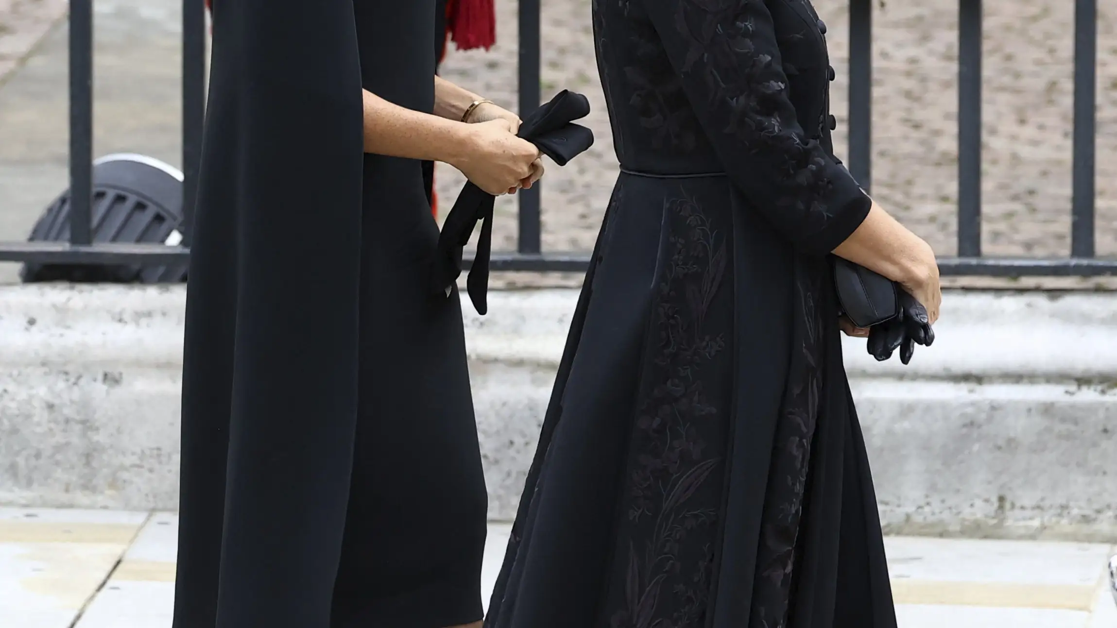 Britain's Sophie, Countess of Wessex, and Britain's Meghan, Duchess of Sussex walk outside the Westminster Abbey on the day of Queen Elizabeth II funeral, in London Monday, Sept. 19, 2022. (Hannah McKay/Pool Photo via AP)