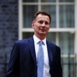 Jeremy Hunt leaves 10 Downing Street in London after he was appointed Chancellor of the Exchequer following the resignation of Kwasi Kwarteng, Friday Oct. 14, 2022. Chancellor of the Exchequer Kwasi Kwarteng said he has accepted Prime Minister Liz Truss' request he "stand aside" as Chancellor, paying the price for the chaos unleashed by his mini-budget. (Victoria Jones/PA via AP)