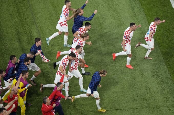 Croatia players celebrate at the end of the World Cup third-place playoff soccer match between Croatia and Morocco at Khalifa International Stadium in Doha, Qatar, Saturday, Dec. 17, 2022. Croatia won 2-1. (AP Photo/Pavel Golovkin)