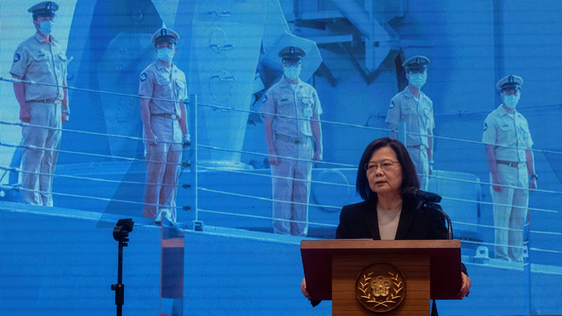 Taipei (Taiwan), 27/12/2022.- Taiwan President Tsai Ing-wen speaks in front of a screen showing defense forces, during a press conference in Taipei, Taiwan, 27 December 2022. Tsai addresses national security issues including the recent Chinese military incursion above Taiwan airspace on 26 December. EFE/EPA/RITCHIE B. TONGO
