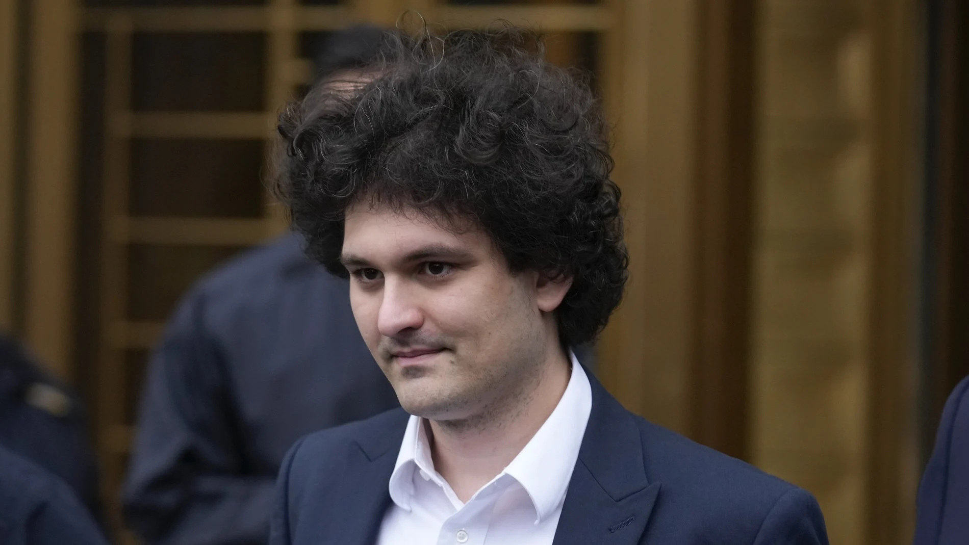 Samuel Bankman-Fried leaves Manhattan federal court in New York, Tuesday, Jan. 3, 2023. Bankman-Fried pleaded not guilty to charges that he cheated investors and looted customer deposits on his cryptocurrency trading platform as a judge set a tentative trial date for October. (AP Photo/Seth Wenig)
