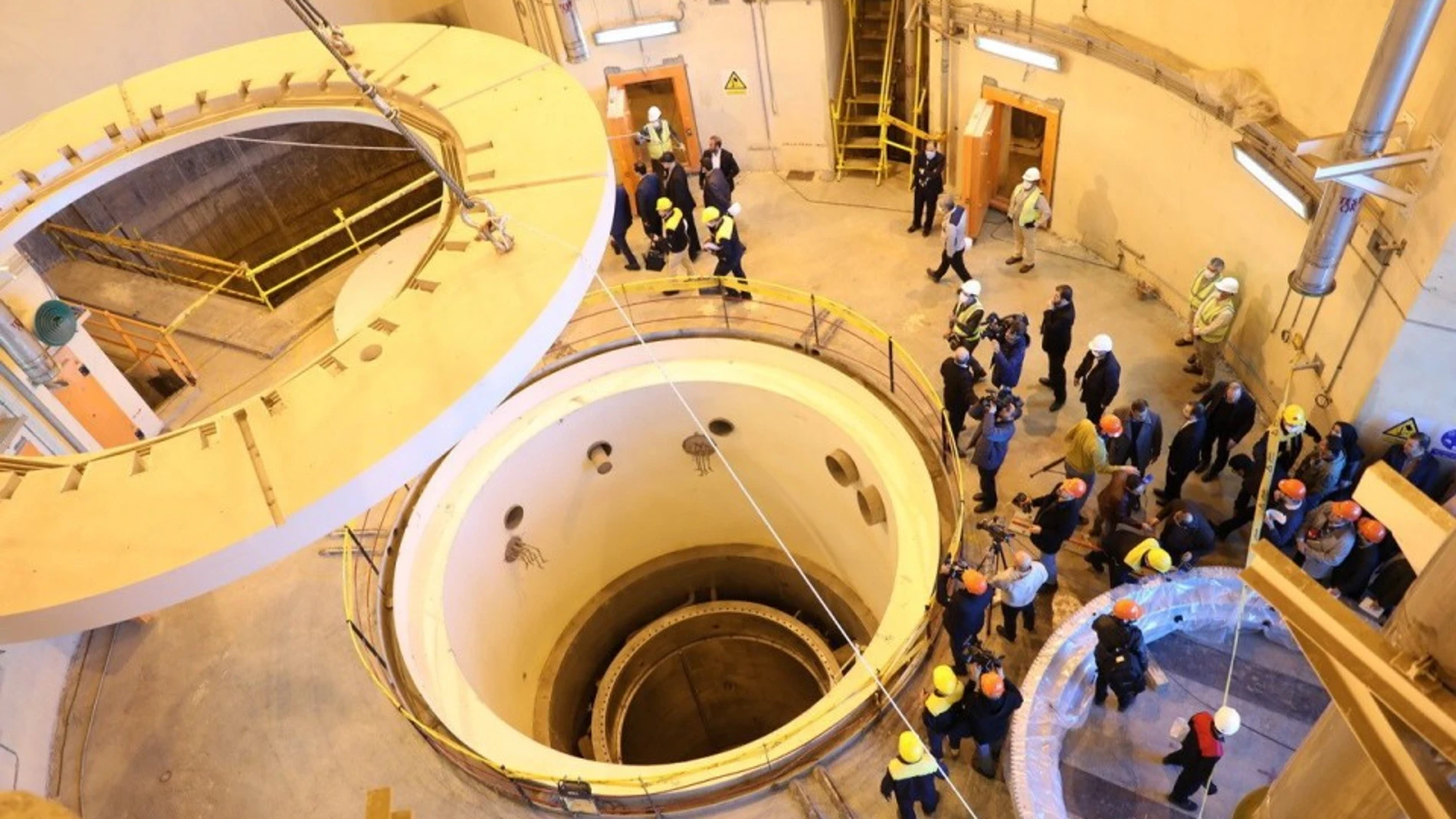 A handout photo made available by Iran's Atomic Energy Organisation shows head of the organisation Ali Akbar Salehi (C) speaks to media during his visits to nuclear water reactor of Arak, in the city of Arak, central Iran.