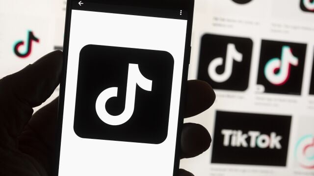 The TikTok logo is seen on a cell phone on Oct. 14, 2022, in Boston. The White House is giving all federal agencies 30 days to wipe TikTok off all government devices, as the Chinese-owned social media app comes under increasing scrutiny in Washington over security concerns. 